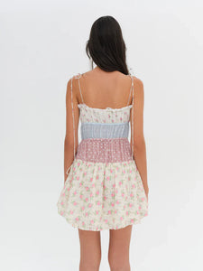 Introducing the Elula Mini Dress from For Love and Lemons. Experience the nostalgic charm of summer Sundays and countryside living with its vintage-inspired patchwork design. The lace ruffle neckline adds a touch of elegance to this timeless sundress. Embrace the carefree and effortless style all season long.