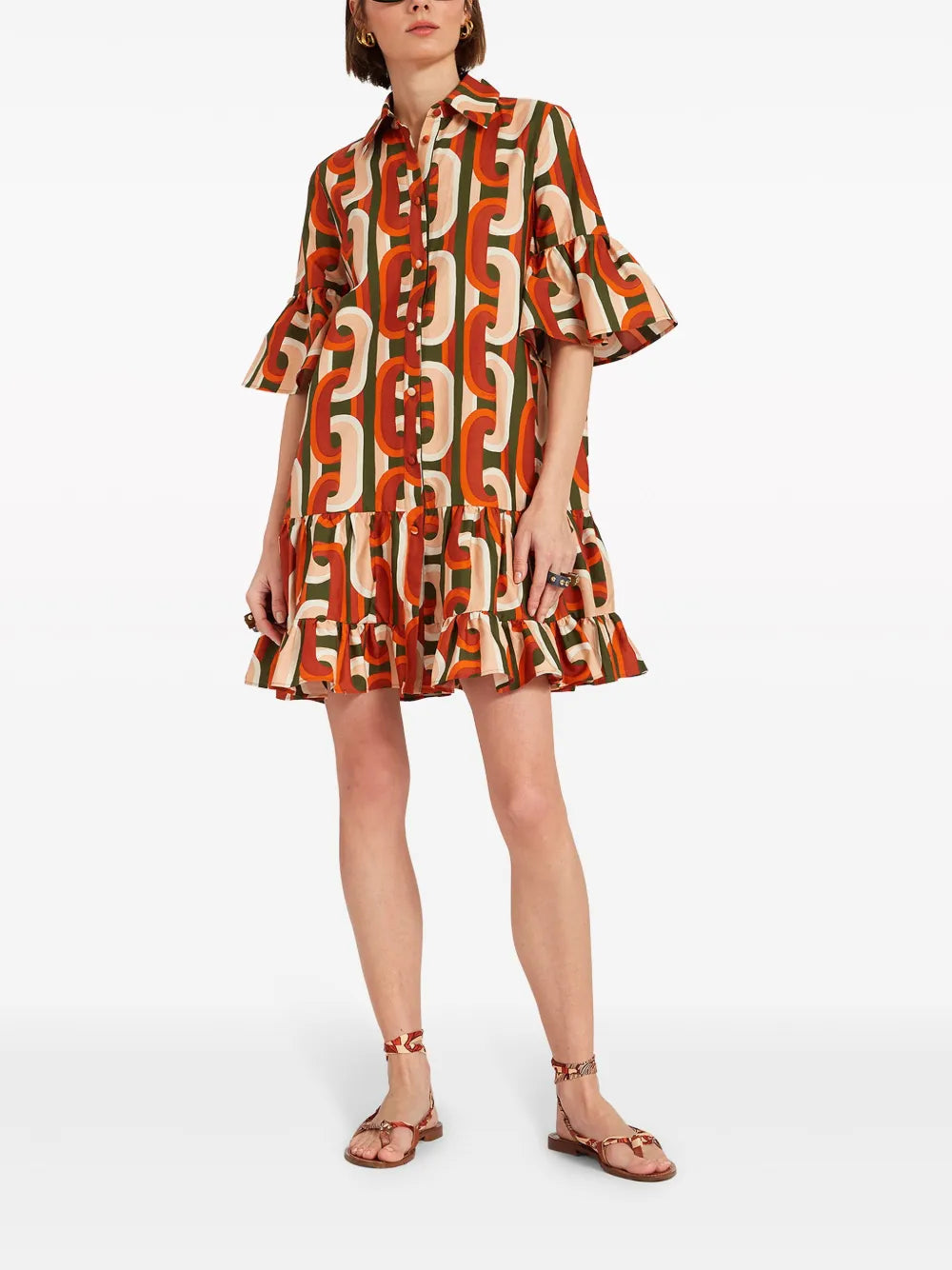 Elevate your everyday style with La DoubleJ's Choux cotton mini dress, a vibrant Italian-crafted piece that effortlessly blends playful design with timeless elegance. Featuring a striking geometric-pattern print in multicolour, this dress showcases a charming pointed collar, front button fastening, and short sleeves with flared cuffs that add a touch of whimsy. 