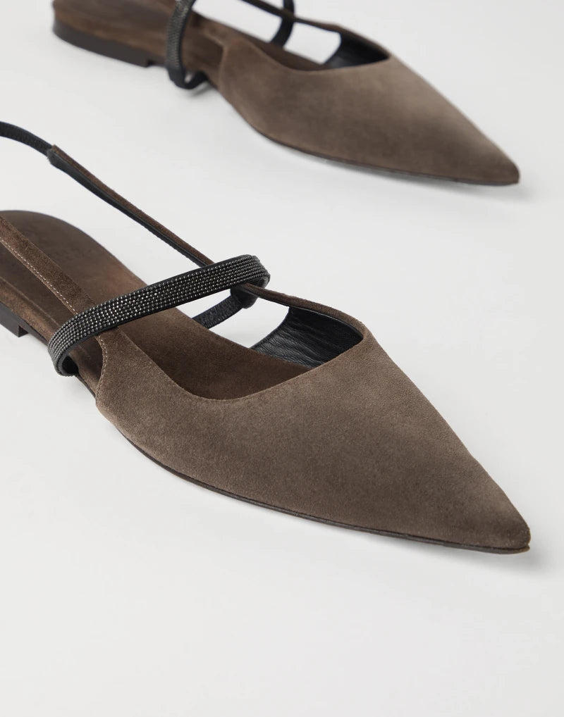 Elevate your style with our Monili-chain suede ballerina shoes from Brunello Cucinelli. The smooth and velvety texture of the precious suede, combined with sparkling monili embroidery on the thin instep strap, creates a contemporary and feminine aesthetic. Perfect for those who seek adventure and style, these flats are the perfect addition to any outfit.