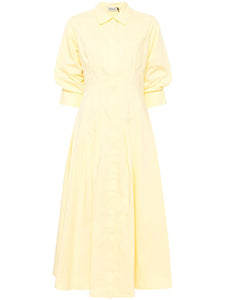 Introducing the Simkhai Jazz Midi Dress in a striking sulfur yellow. Made with a comfortable cotton blend, this dress features pintuck detailing and a straight-point collar. The three-quarter length puff sleeves and flared skirt add a touch of femininity. With a concealed front button fastening, buttoned-cuff sleeves, and two side inset pockets, this dress is both functional and stylish. Complete with full lining and a midi-length straight hem, this dress is perfect for any occasion.