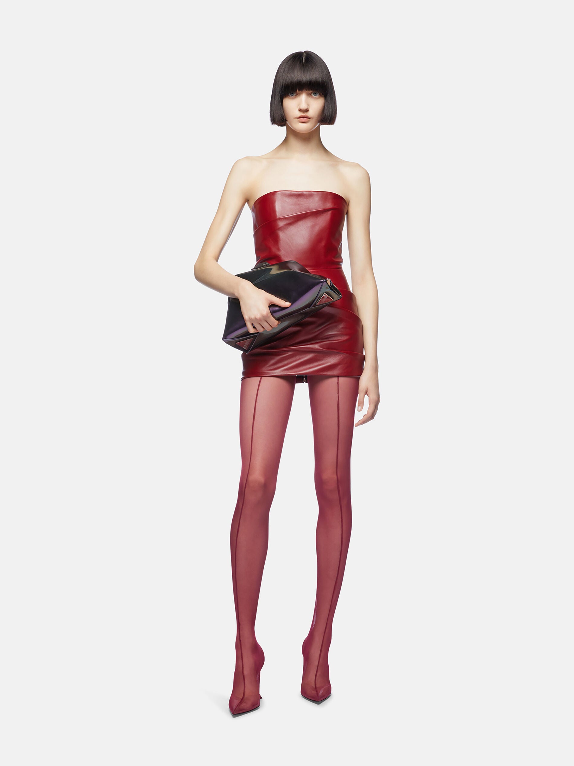 Indulge in luxury with the Vibrant Red Mini Dress by The Attico! Expertly crafted from smooth lambskin, this stunning Mini Dress is designed to make you feel sleek and sophisticated. The bustier-style neckline and strapless design add a touch of elegance, while the draped detailing and thigh-length bring convenience and style. Must-have for any special occasion.