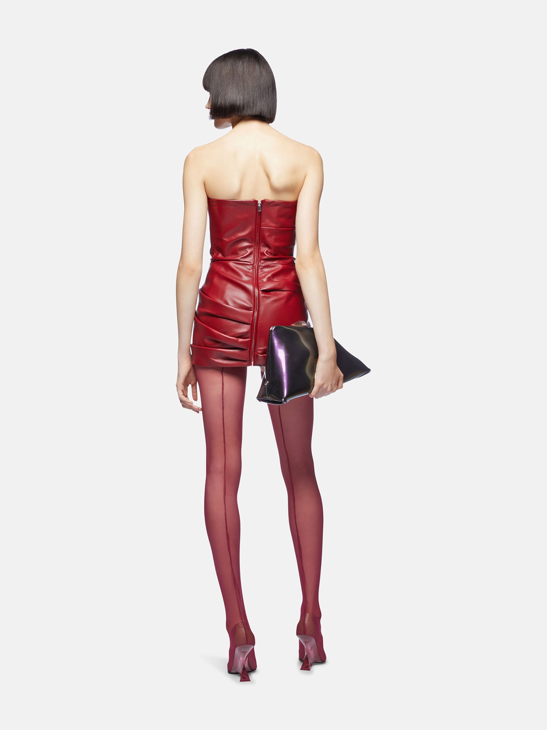 Indulge in luxury with the Vibrant Red Mini Dress by The Attico! Expertly crafted from smooth lambskin, this stunning Mini Dress is designed to make you feel sleek and sophisticated. The bustier-style neckline and strapless design add a touch of elegance, while the draped detailing and thigh-length bring convenience and style. Must-have for any special occasion.