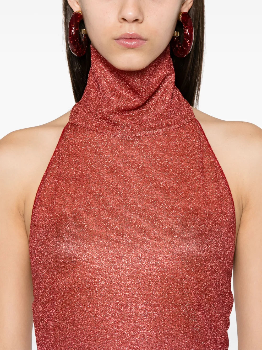 Elevate your wardrobe with this Italian-made Lurex midi dress, featuring a sophisticated dark pink hue and a subtle ombré effect. The halterneck design enhances your neckline, while the side slit adds a touch of allure and ease of movement. Crafted unlined for lightweight comfort, this dress combines elegance with contemporary style, perfect for refined occasions.