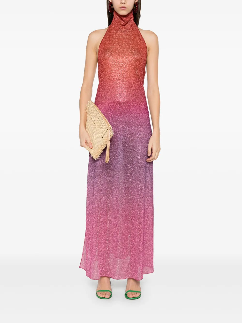 Elevate your wardrobe with this Italian-made Lurex midi dress, featuring a sophisticated dark pink hue and a subtle ombré effect. The halterneck design enhances your neckline, while the side slit adds a touch of allure and ease of movement. Crafted unlined for lightweight comfort, this dress combines elegance with contemporary style, perfect for refined occasions.