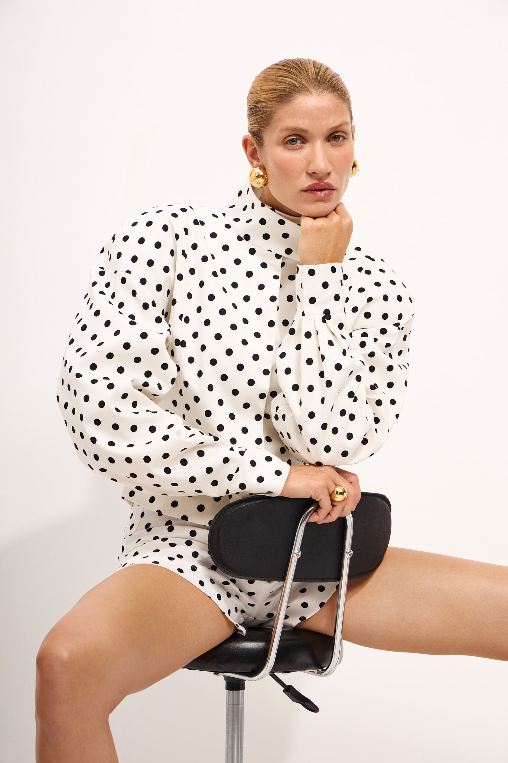 Elevate your casual wardrobe with the Delilah Jacket, a striking two-piece polka dot set that effortlessly blends style and comfort. Featuring a commanding stand collar jacket paired with coordinating shorts, this ensemble delivers the perfect balance of relaxed sophistication and contemporary edge. Long sleeves and a thoughtfully relaxed silhouette create an undeniably chic silhouette that works as hard as you do—whether you're running weekend errands or stepping out for an evening. 