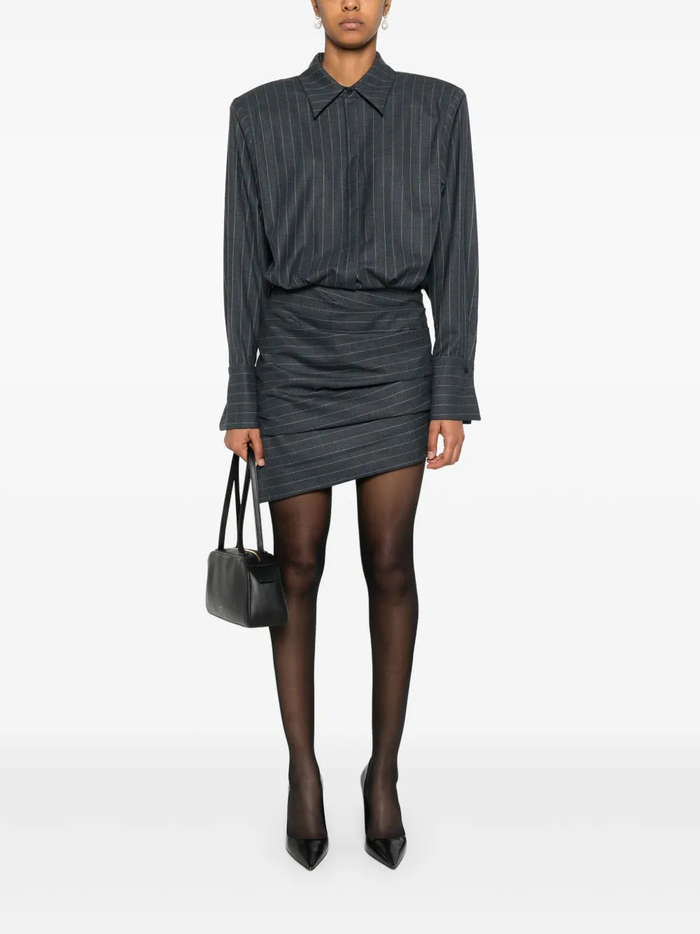 The Narine mini dress by Retrofete features a sophisticated charcoal and light grey pinstripe pattern, crafted with expert tailoring. It includes a concealed front button fastening and side zip for a seamless look, while shoulder pads and ruched detailing add structured elegance. The dress is finished with a pointed flat collar, long sleeves with buttoned cuffs, a straight hem, and full lining for comfort and quality. Ideal for those seeking a refined, modern silhouette with subtle detailing.