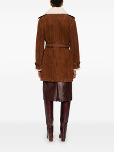 Take on the world in the bold and adventurous Suede Shearling Coat by Ermanno Scervino. Hand-dyed and crafted from luxurious suede, this double-breasted coat features military-inspired buttons and a striking trench coat design with shoulder loops and strap cuffs. Its light gold galvanic plating adds a touch of daring sophistication.