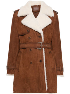 Take on the world in the bold and adventurous Suede Shearling Coat by Ermanno Scervino. Hand-dyed and crafted from luxurious suede, this double-breasted coat features military-inspired buttons and a striking trench coat design with shoulder loops and strap cuffs. Its light gold galvanic plating adds a touch of daring sophistication.