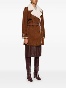 Take on the world in the bold and adventurous Suede Shearling Coat by Ermanno Scervino. Hand-dyed and crafted from luxurious suede, this double-breasted coat features military-inspired buttons and a striking trench coat design with shoulder loops and strap cuffs. Its light gold galvanic plating adds a touch of daring sophistication.