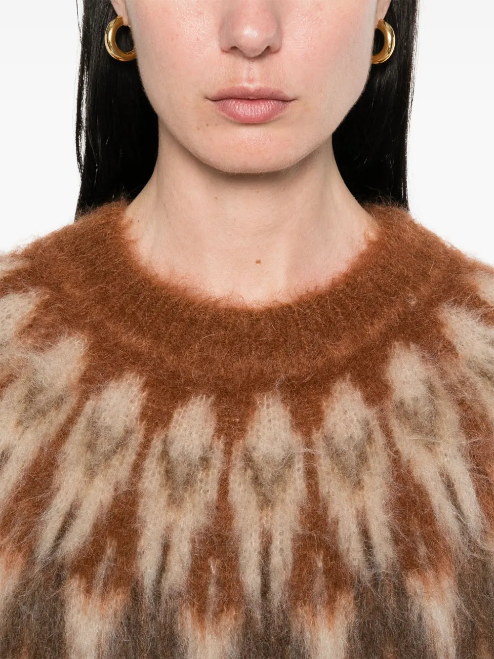 The Natania Sweater by Isabel Marant brings effortless sophistication to your everyday wardrobe. Crafted in a rich cognac brown, this piece features an eye-catching all-over graphic print that adds visual interest and personality. The classic crew neck and long sleeves provide timeless comfort, while ribbed trim at the cuffs and hem ensures a polished, structured fit. Perfect for layering or wearing solo, this sweater seamlessly transitions from casual days to elevated evenings.