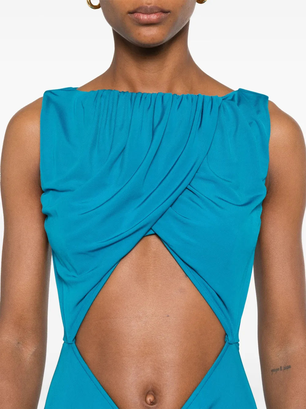 Elevate your evening wardrobe with this stunning Christopher Esber Bateau draped gown, a masterpiece of contemporary design. Crafted from imported materials, this sleeveless silhouette features an alluring imperial blue hue that commands attention. The expertly placed cut-out detailing and ruched accents create dynamic visual interest, while the concealed rear zip fastening ensures a seamless, polished finish. 