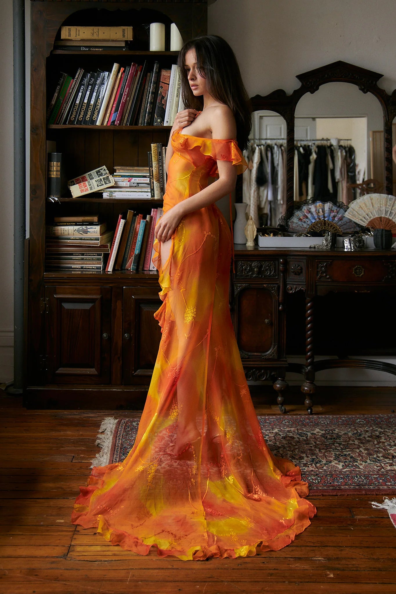 Experience luxury with our Dress Sunset. Made from hand painted silk burn-out chiffon, this dress is one of a kind. Each dress is unique due to the hand painted fabric, making it a true work of art. Elevate your wardrobe with this exclusive and elegant piece.