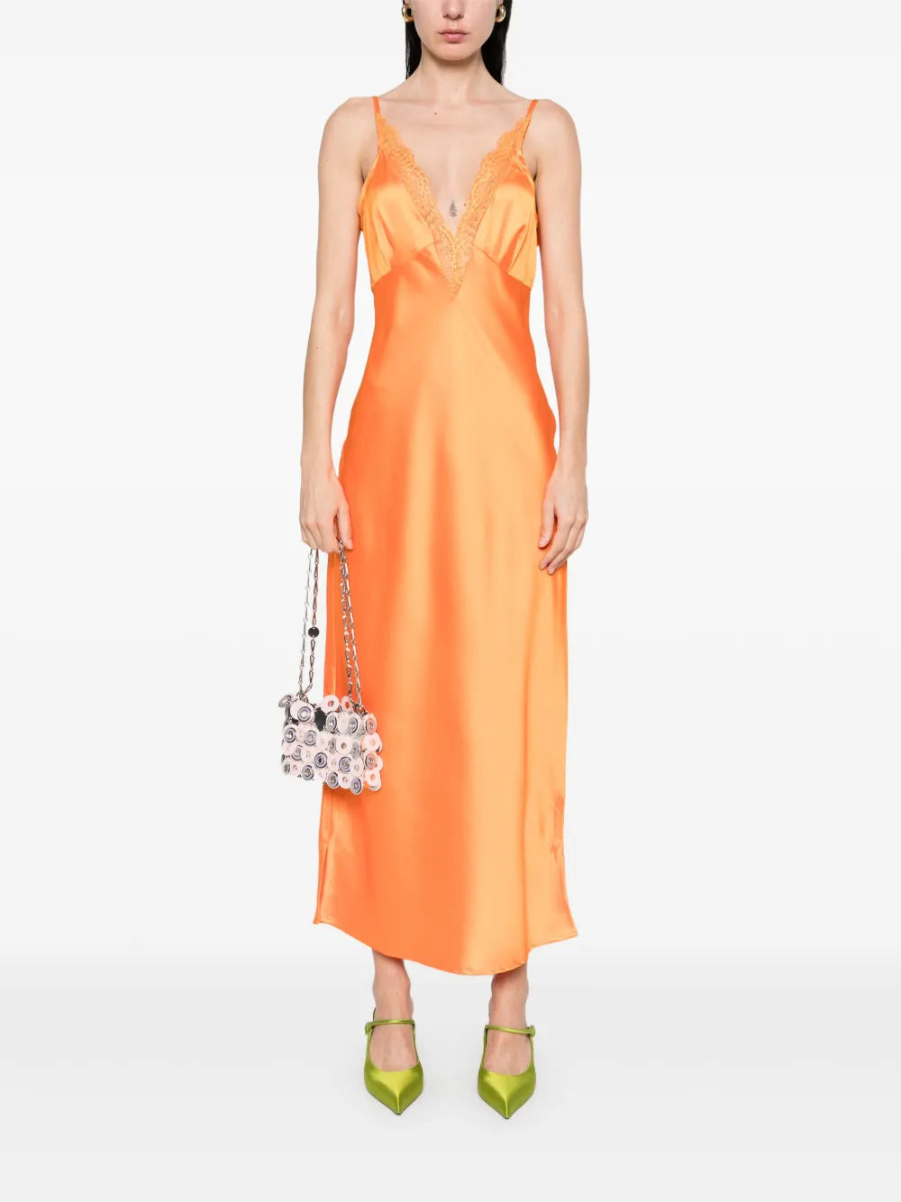 The Caetana dress combines sophistication and allure with adjustable shoulder straps and a plunging V-neck that enhances your silhouette. Detailed with scalloped eyelash lace trim and side splits at the hem, this dress adds a delicate, feminine touch while allowing graceful movement. Perfect for making a memorable impression at any event.