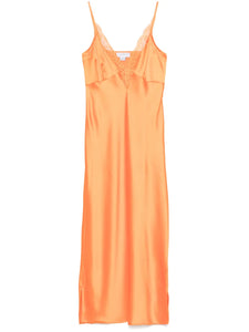 The Caetana dress combines sophistication and allure with adjustable shoulder straps and a plunging V-neck that enhances your silhouette. Detailed with scalloped eyelash lace trim and side splits at the hem, this dress adds a delicate, feminine touch while allowing graceful movement. Perfect for making a memorable impression at any event.