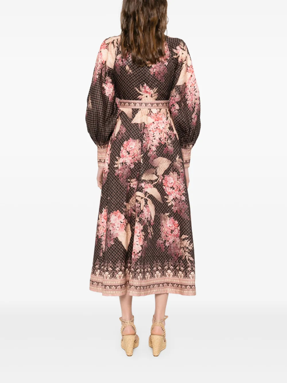Experience effortless elegance with the Illuminate Linen Dress by Zimmermann. Crafted in breathable black linen, this dress features a delicate floral motif and a flattering front button fastening for easy wear. Long sleeves with buttoned cuffs add sophistication, making it perfect for both day and evening occasions. Embrace timeless style and comfort in this versatile piece that elevates your wardrobe with subtle charm.