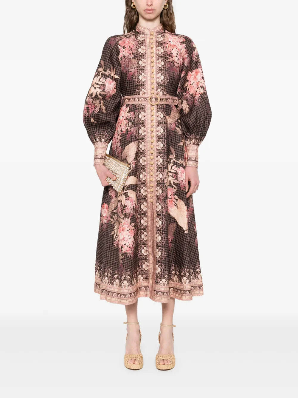 Experience effortless elegance with the Illuminate Linen Dress by Zimmermann. Crafted in breathable black linen, this dress features a delicate floral motif and a flattering front button fastening for easy wear. Long sleeves with buttoned cuffs add sophistication, making it perfect for both day and evening occasions. Embrace timeless style and comfort in this versatile piece that elevates your wardrobe with subtle charm.