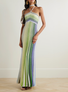 Missoni’s Sequin-embellished Metallic Crochet-knit Halterneck Maxi Dress elevates occasion dressing with vibrant style. Crafted in Italy with metallic threads, its vivid striped pattern catches the eye, while shimmering sequins add an elegant sparkle. The silver halterneck strap beautifully frames the collarbones, making this dress a stunning choice for any special event.