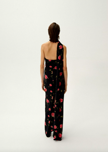 Introducing the luxurious Rose Print Jersey Long Dress by Magda Butrym. This stunning dress features a back zip closure and center back slit for ease of wear and a flattering silhouette. The non-detachable scarf panel adds a touch of elegance and the all over print placement may vary, making each dress unique. Elevate your wardrobe with this must-have piece.