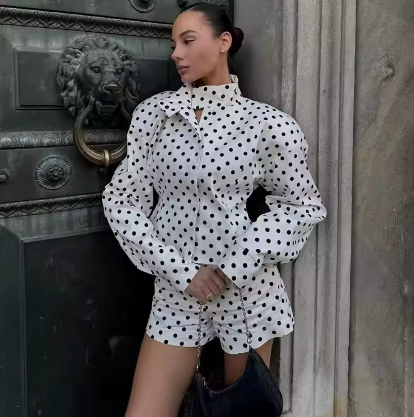 Elevate your casual wardrobe with the Delilah Jacket, a striking two-piece polka dot set that effortlessly blends style and comfort. Featuring a commanding stand collar jacket paired with coordinating shorts, this ensemble delivers the perfect balance of relaxed sophistication and contemporary edge. Long sleeves and a thoughtfully relaxed silhouette create an undeniably chic silhouette that works as hard as you do—whether you're running weekend errands or stepping out for an evening. 