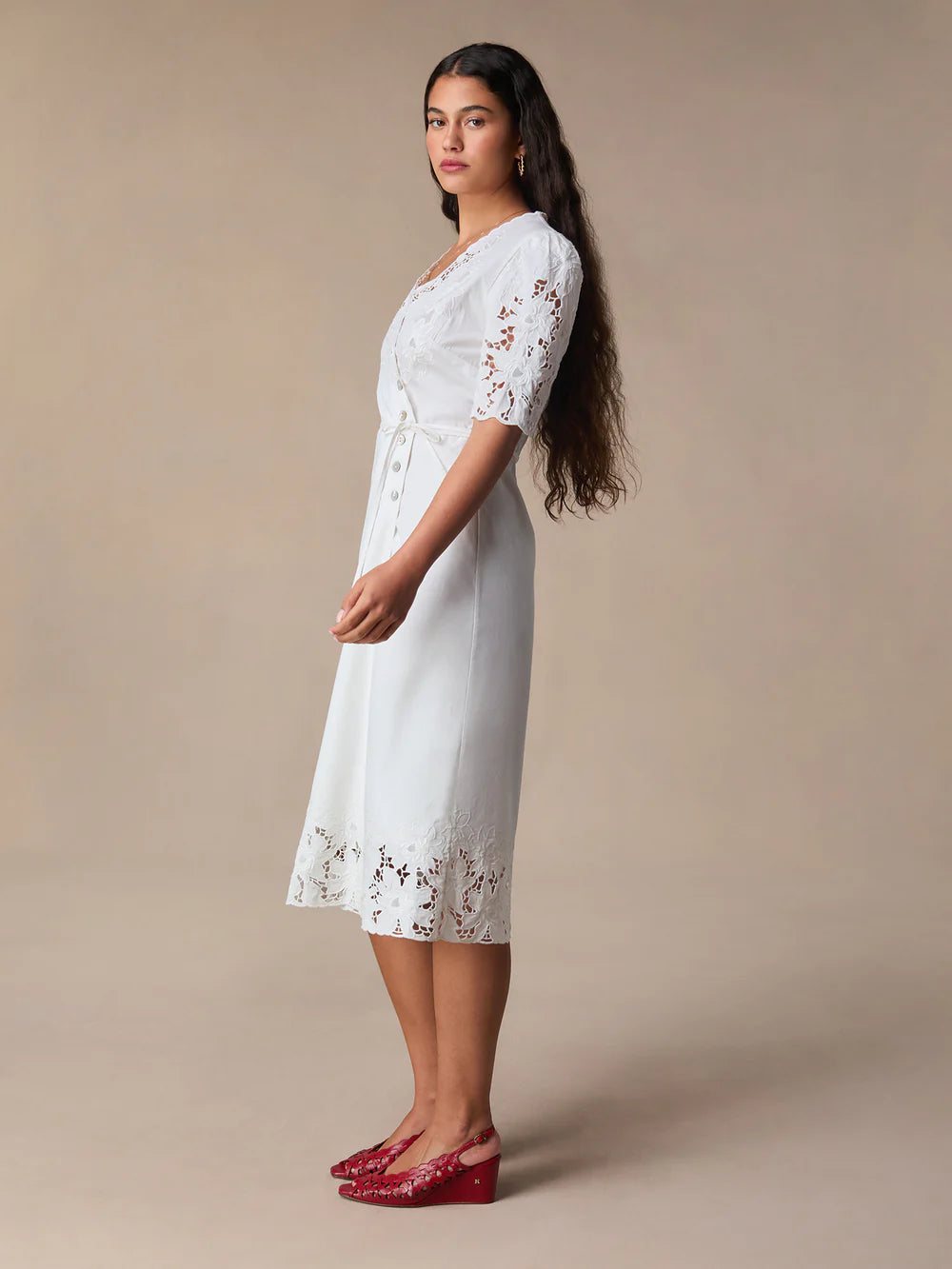 Transform your wardrobe with our Sara Midi Dress! This stunning white embroidered wrap dress exudes elegance and charm. Perfect for any occasion, its mid-length style offers a timeless silhouette that will flatter any body type. Make a statement with this must-have dress that will leave you feeling confident and beautiful.