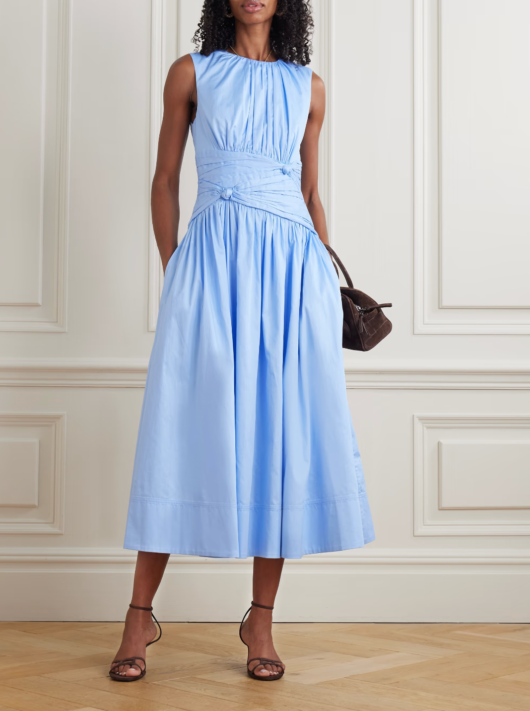 The Agatha Poplin Midi Dress by Aje features a flattering gathered, knotted waist that accentuates your silhouette. Crafted from soft cotton-poplin, it offers gentle pleats that add volume and flow elegantly to a midi length. In a versatile Powder Blue shade, this dress pairs beautifully with gold, silver, or pearl accessories, making it a perfect choice for both casual and refined occasions.