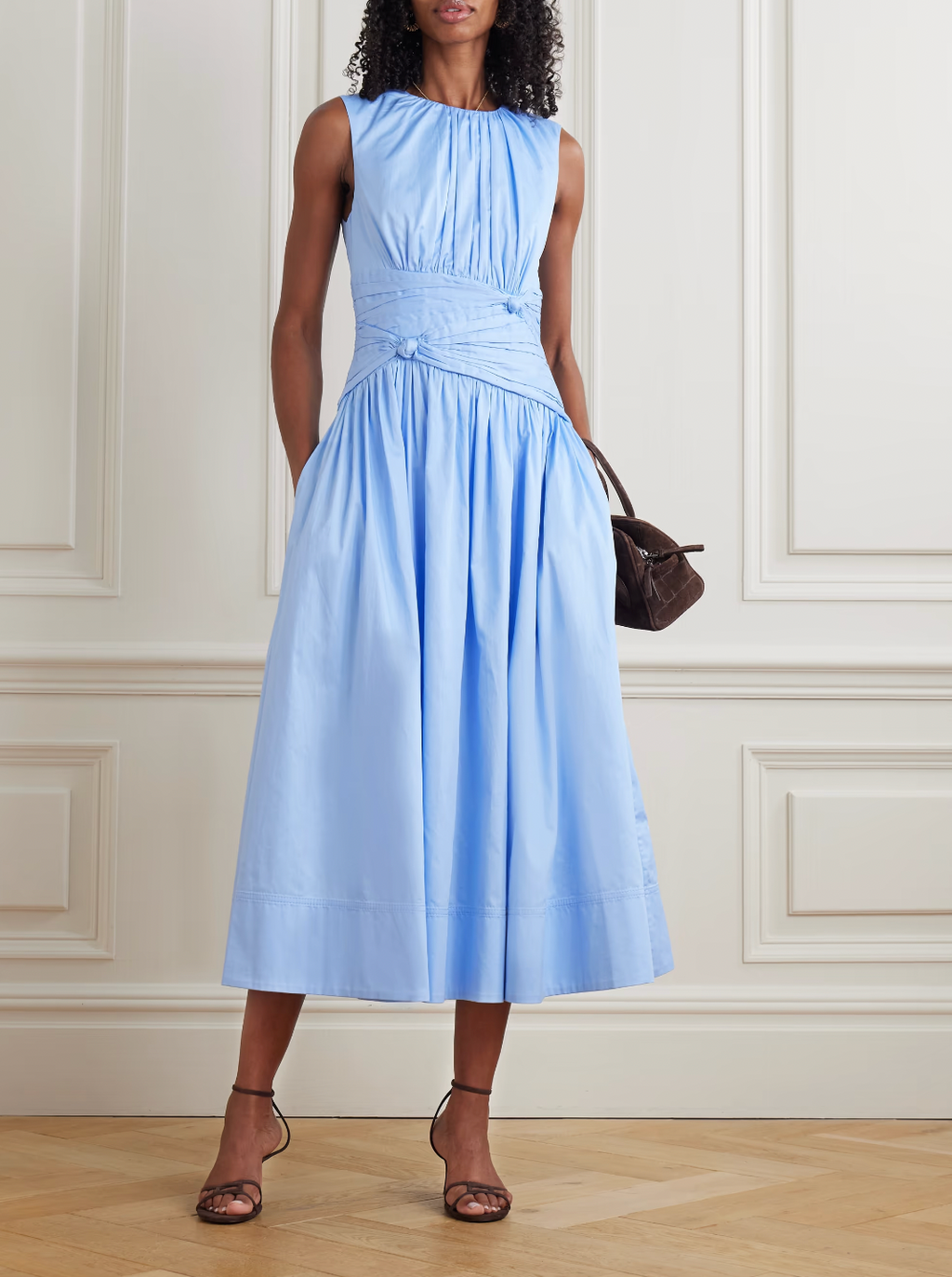 The Agatha Poplin Midi Dress by Aje features a flattering gathered, knotted waist that accentuates your silhouette. Crafted from soft cotton-poplin, it offers gentle pleats that add volume and flow elegantly to a midi length. In a versatile Powder Blue shade, this dress pairs beautifully with gold, silver, or pearl accessories, making it a perfect choice for both casual and refined occasions.