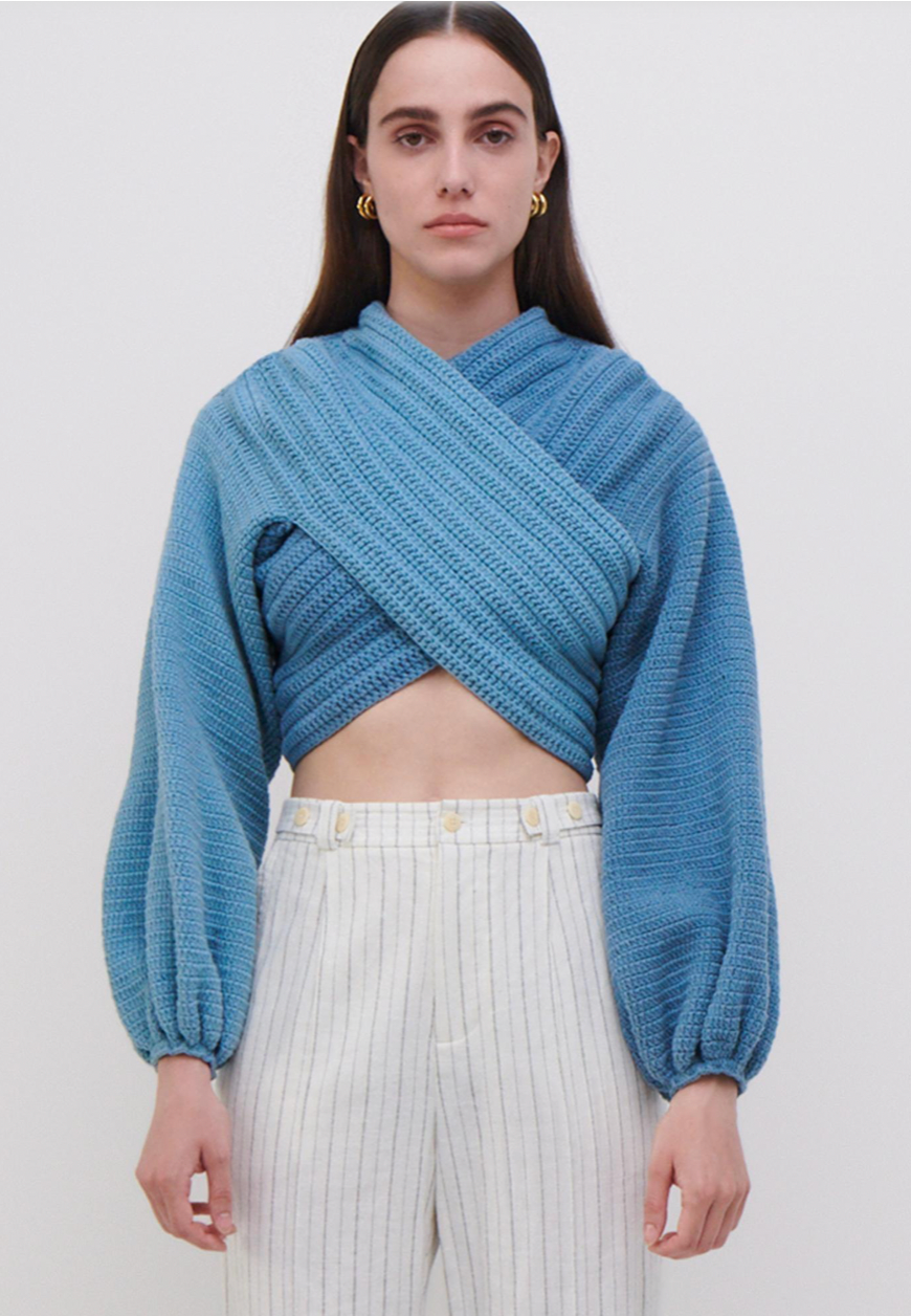 Experience the perfect blend of style and impact with our JONATHAN SIMKHAI x ELEXIAY EXCLUSIVE Pull en Crochet. Handmade in Nigeria by women crochet artists, this Cove/Adriatic pullover embodies a powerful collaboration that supports local artisans. Elevate your wardrobe while making a positive difference.