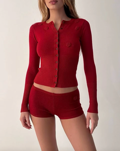 Indulge in luxurious warmth this season with the Lenon Cloud Knit Button Up Cardigan by Frankies Bikinis. The signature cloud knit fabric creates a soft and cozy feel, while the functional buttons and exaggerated cuffs add an elegant touch. Complete with ribbing on the waist and cuffs, the Lenon cardigan is the perfect statement piece for your winter wardrobe.