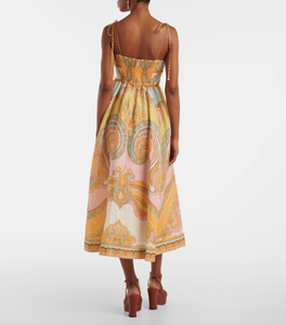 Elevate your wardrobe with the Maxine Picnic paisley linen bustier dress from Zimmermann. This midi-length dress showcases a timeless paisley placement print on breathable linen, highlighting a fitted bustier with delicate gathering and flat piping for a flattering silhouette. Self-tie straps offer adjustable comfort, while side seam pockets add practical charm. Perfect for warm days and stylish gatherings, this dress effortlessly combines elegance and ease.