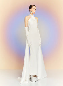 The dramatic silhouette of Solace London's 'Rumi' gown will ensure you'll make a memorable entrance. It's cut from stretch-crepe to hug your figure with glossy satin-twill that wraps around the neck and waist before falling at the sides to an asymmetric hem. Style yours with glittering earrings and elbow-length velvet gloves.