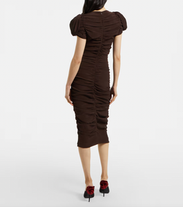 Elevate your wardrobe with this expert-crafted puff-sleeve silk midi dress by Magda Butrym. Designed with voluminous sleeves and a fluid silhouette, it combines luxurious silk fabric with sophisticated tailoring to create a timeless piece. Perfect for formal events or refined everyday elegance, the dress offers both comfort and statement style, reflecting meticulous attention to detail and high-quality craftsmanship.