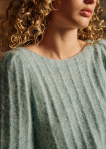 Stay cozy and chic in the Aretha Jumper. Made from a luxurious blend of wool and kid mohair, this jumper features long puffed sleeves and a boat neckline for a stylish and comfortable fit. The patterned knit adds a touch of texture, making it the perfect addition to your fall and winter wardrobe.