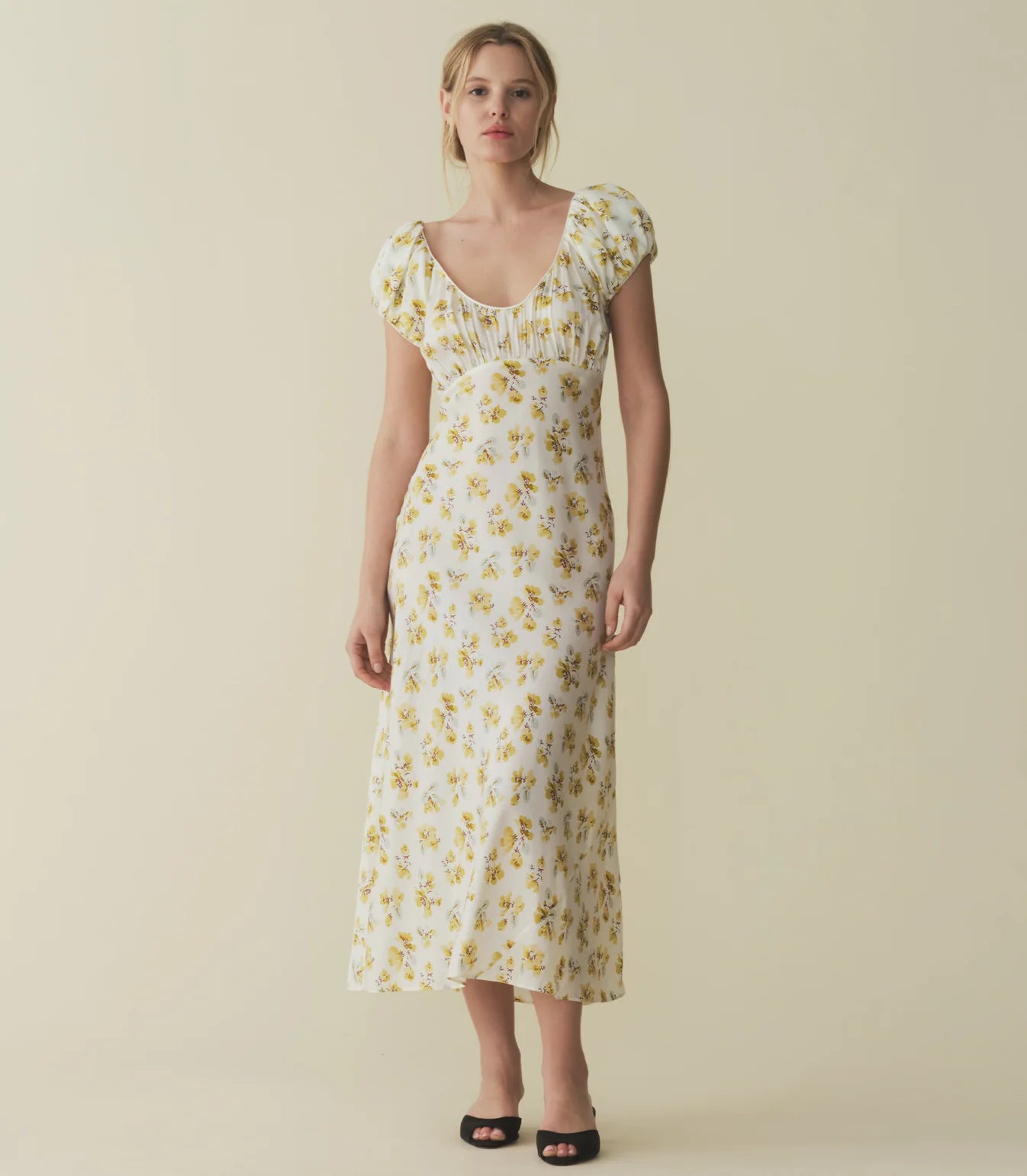 In a luminous blend of silk and viscose, the Florencia Dress—which takes cues from ‘30s gowns—features a soft scooped V-neckline, ruching at the bust and sleeves, and an ankle-length bias-cut skirt.