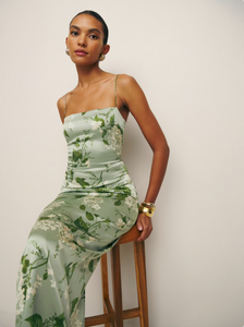 This Frankie Silk Dress in Tea Garden boasts a square neckline and back slit, made from a lightweight 100% silk charmeuse fabric. Non-adjustable straps and back provide a comfortable fit, while the back zipper allows for ease of wear. Dry clean only for care.&nbsp;