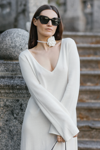 Make a statement with our versatile and timeless V-neck dress in a creamy hue. Perfect for any occasion, from parties to weddings to spring strolls. This dress complements a variety of accessories, allowing you to express your unique style. A must-have for your wardrobe, never going out of style.