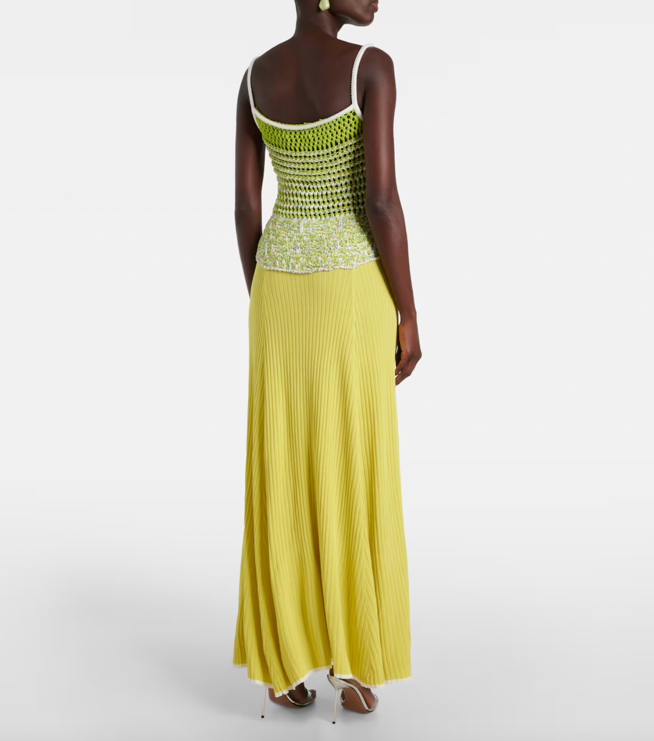 This Lace-trimmed slip dress by Christopher Esber boasts a stunning V-neck collar and delicate sleeveless design. With beautiful crochet panelling, this elegant piece is perfect for any formal occasion. Made from high-quality fabrics, it offers both style and comfort, making you the center of attention.