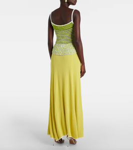 This Lace-trimmed slip dress by Christopher Esber boasts a stunning V-neck collar and delicate sleeveless design. With beautiful crochet panelling, this elegant piece is perfect for any formal occasion. Made from high-quality fabrics, it offers both style and comfort, making you the center of attention.