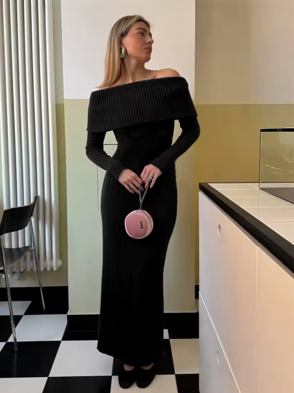 This knitted midi dress offers a perfect balance of comfort and sophistication. Crafted from stretchy knit fabric, it ensures ease of movement with a relaxed fit. The folded off-shoulder neckline adds an elegant flair, complemented by long sleeves featuring subtle slit details for a refined, contemporary look. Ideal for sophisticated casual occasions, this dress delivers effortless style without compromising on wearability.