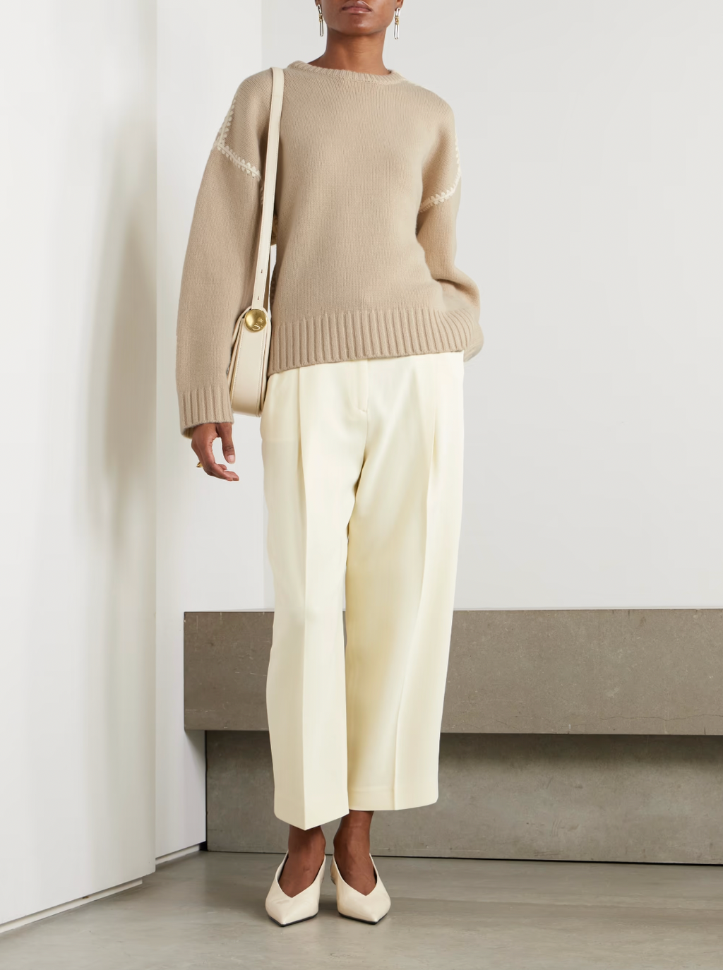 Elevate your wardrobe with this oversized sweater by Toteme crafted from a sumptuous wool and cashmere blend. Its relaxed fit with dropped shoulders offers effortless comfort, while the contrasting cream embroidery adds a refined, distinctive touch. Designed as a timeless staple, it seamlessly enriches your collection, providing both warmth and style for any occasion.