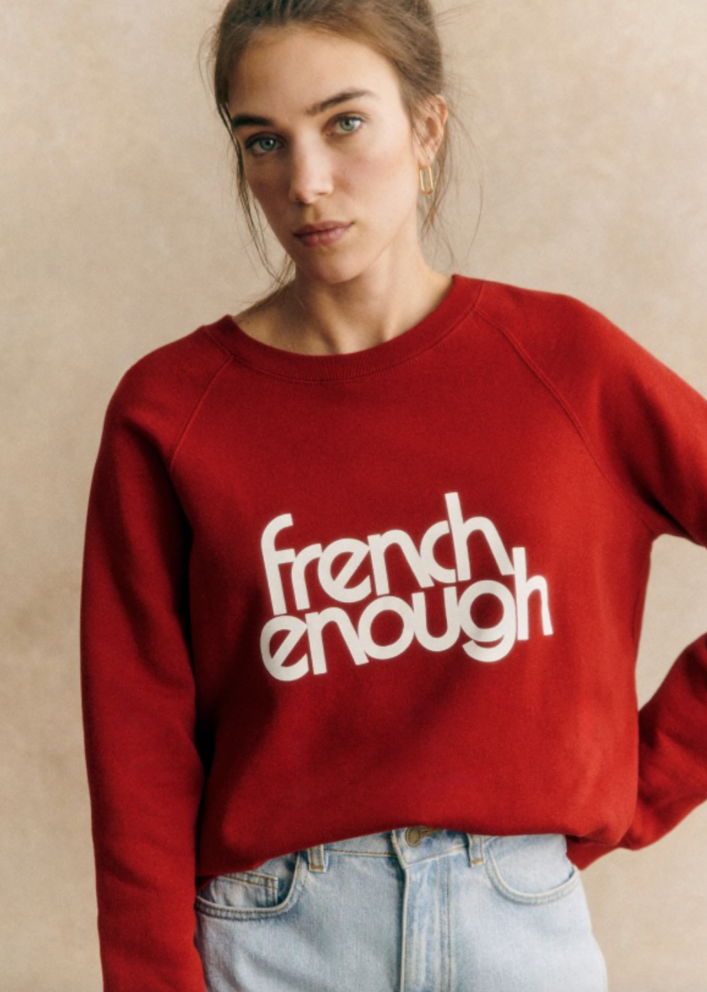 Stay comfy and stylish with this long-sleeved organic cotton sweatshirt. Show off your love for French culture with the "French Enough" print on the front, while staying cozy with the round neckline. Good for you and the environment.