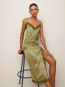 Indulge in pure luxury with the Karissa Silk Dress by Reformation. Crafted from sumptuous silk, this sleeveless midi dress features a flattering V-neckline and delicate lace hem. Perfect for any occasion, it exudes sophistication and elegance. Elevate your wardrobe and make a statement with this must-have piece.