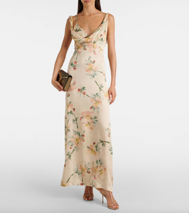 Indulge in luxurious elegance with our Floral Draped Maxi Dress by Toteme. The intricate floral print and draped design effortlessly elevate your style, while allowing for comfortable movement. Perfect for any occasion, this dress exudes sophistication and exclusivity. Experience the beauty of art and fashion with every wearing.