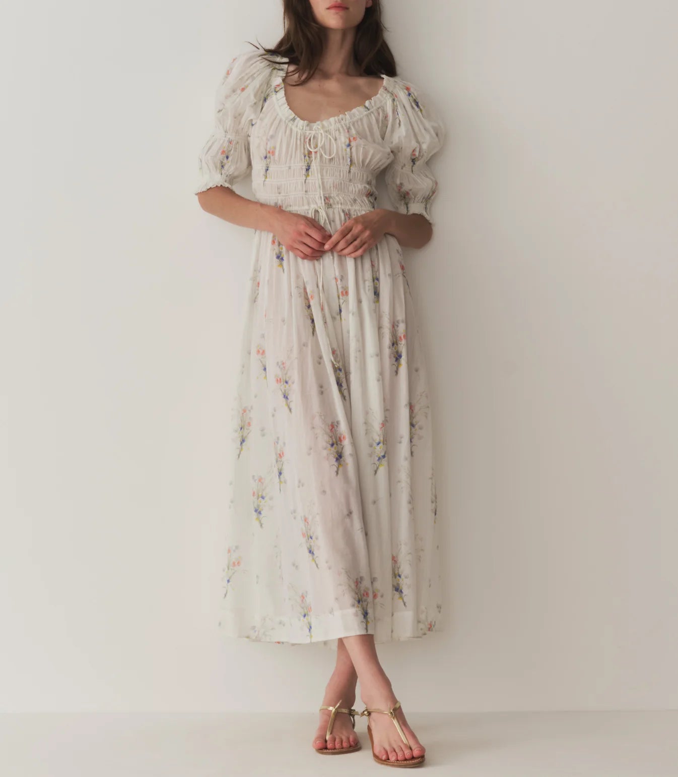 In a soft, lightweight organic cotton voile, the beloved Ischia Dress features double-puffed sleeves and a scoop neckline adorned with petite ruffles and a functional center tie. A smocked bodice with an adjustable waist tie gives way to an ankle-grazing A-line skirt. And, for the first time since we launched the style, we’re reintroducing the Ischia in its original print, a sweet Painted Bouquet floral.