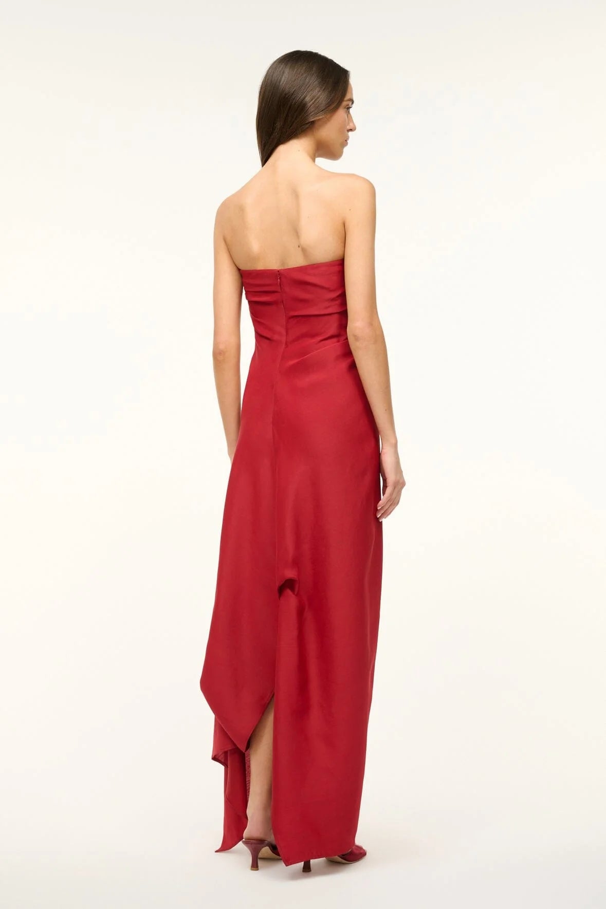 Unleash your daring side with the Caravaggio Dress Rouge by STAUD! This luxurious maxi dress, crafted from a silk wool blend, drapes elegantly and offers structural support with its built-in corset. Perfect for any adventure, this dress combines ease and sophistication. Embrace the challenge and stand out in style!