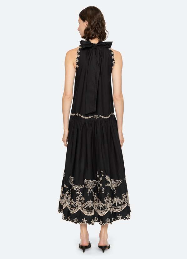 Elevate your wardrobe with the Kingsley Embroidery Tank Dress by SEA NY, designed to combine elegance and ease. Featuring intricate embroidered details, a high neckline, and a charming back bow tie, this dress offers a sophisticated silhouette. The scalloped hemline adds a delicate finishing touch, while the button back closure ensures a relaxed and comfortable fit. Perfect for any occasion, Kingsley blends timeless style with effortless charm.