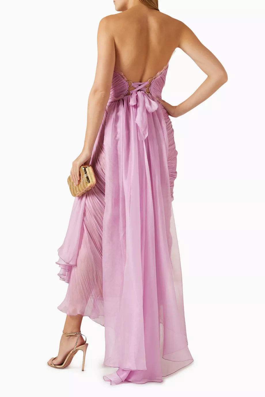 Indulge in high-octane romance with the Julie Ankle Gown from Maria Lucia Hohan. Crafted in Romania with plisse fabric and delicate lace trim, this dress elegantly wraps around your frame and includes a stunning waterfall sash at the waist. Complete the look with a pretty bow at the back for a touch of luxury.