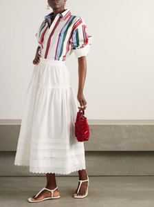 Inspired by Edwardian bridal tradition, this Sebastiane skirt combines timeless elegance with modern sustainability. Crafted from organic cotton-poplin, its tiered silhouette features delicate pintucks and elegant broderie anglaise trim, adding a touch of vintage charm to your wardrobe. Perfect for those who appreciate refined detail and eco-conscious fashion.