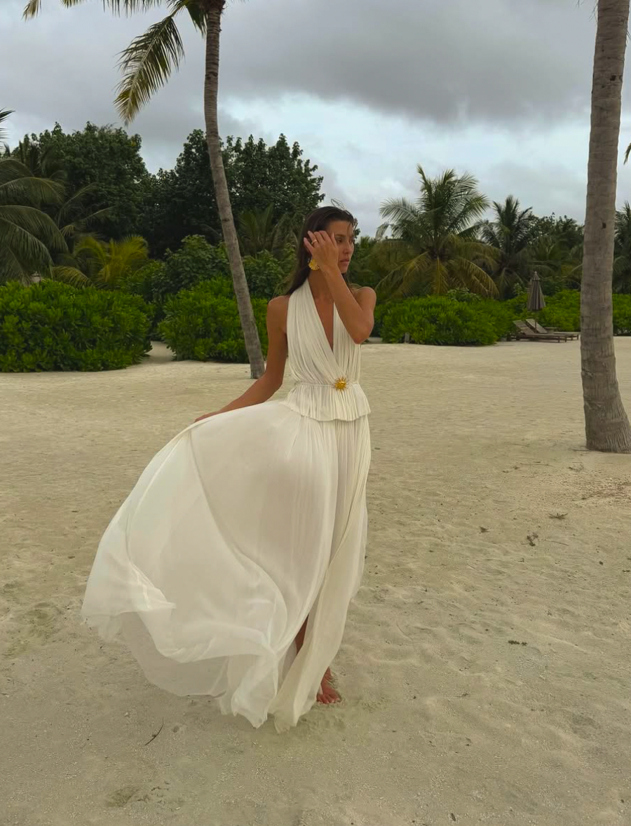 Indulge in luxury with the White Silk Skirt and Top Set. Made of the finest double layered Silk Tulle, this set exudes elegance and quality. With a hidden elastic waist, the skirt offers a perfect fit while the top adds a touch of delicacy. Perfect for any special occasion.