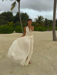 Indulge in luxury with the White Silk Skirt and Top Set. Made of the finest double layered Silk Tulle, this set exudes elegance and quality. With a hidden elastic waist, the skirt offers a perfect fit while the top adds a touch of delicacy. Perfect for any special occasion.