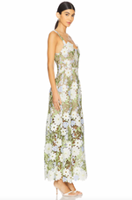 Load image into Gallery viewer, Elevate your style with the Flora Dress. This elegant gown is designed to turn heads at any occasion. Crafted with a flattering fit, the flared hemline adds a touch of drama as you make your entrance. Stand out in confidence with this fitted event-wear maxi dress.
